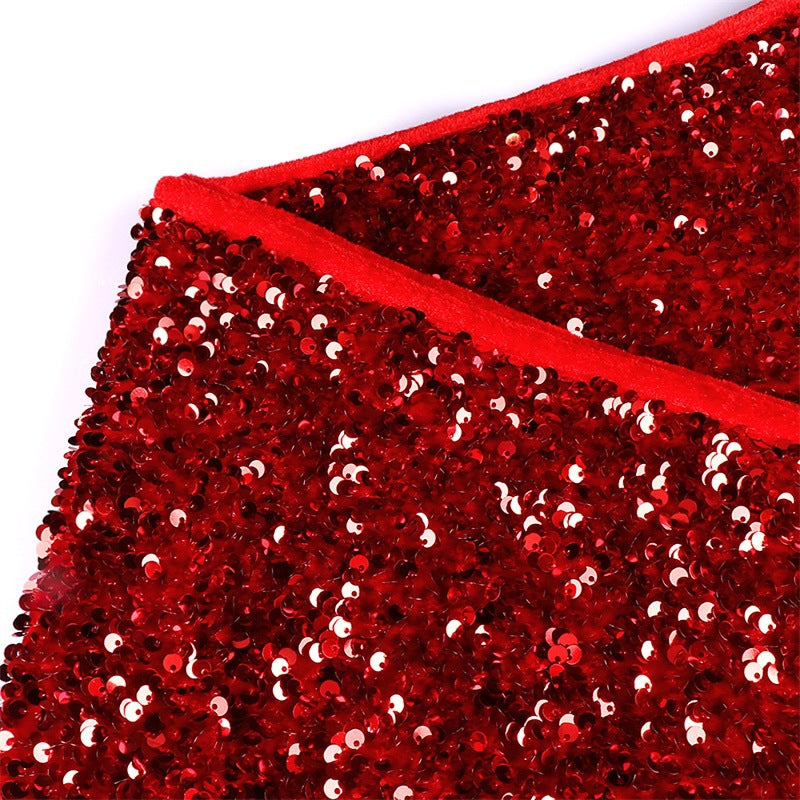 Festive red sequin tree skirt ready for Christmas holiday decorating season