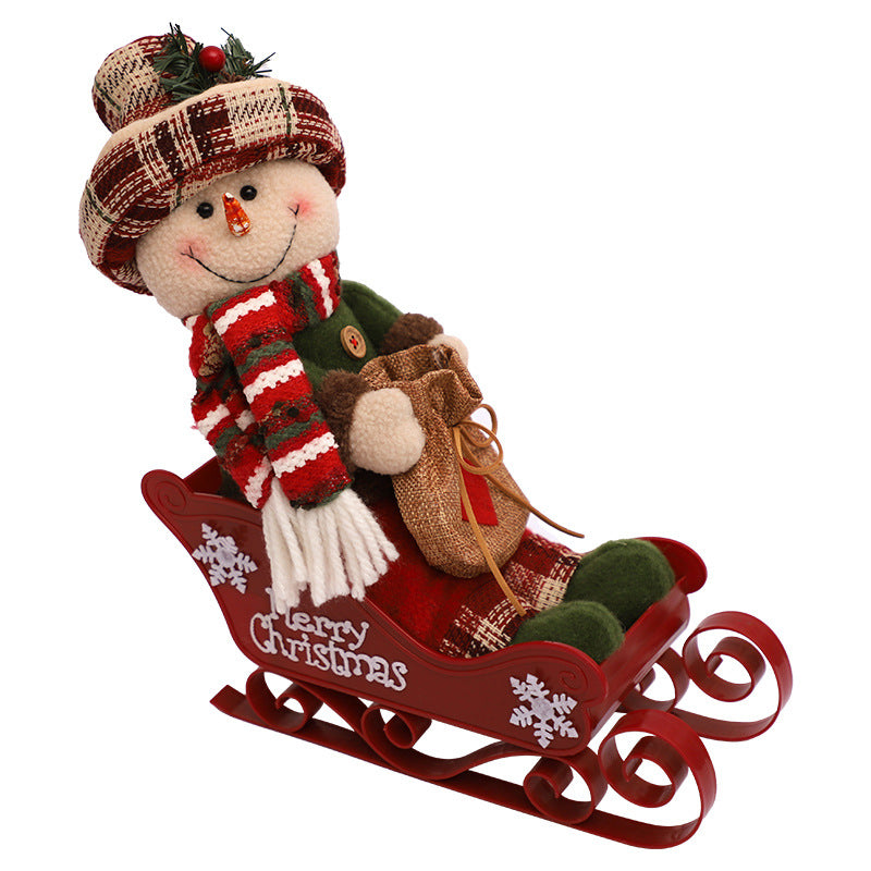 Multiple sled doll ornaments showing collection of holiday figures
