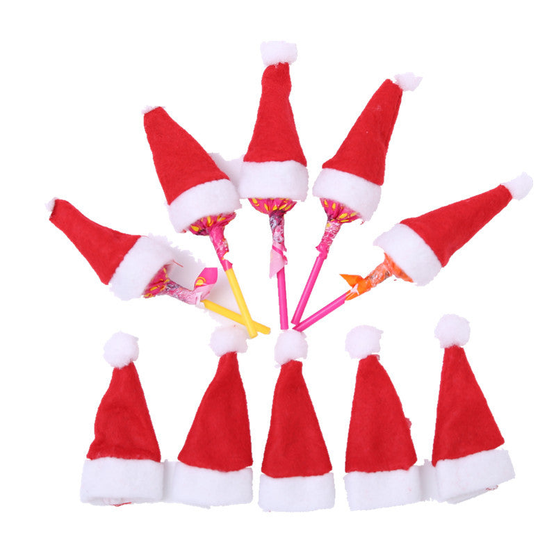 Christmas mini hat decoration displayed on decorated holiday tree branch