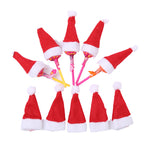 Christmas mini hat decoration displayed on decorated holiday tree branch