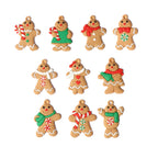 Gingerbread man ornament hanging on decorated Christmas tree branch