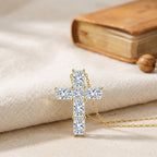 Close-up of princess-cut sparkling stones set in polished gold cross pendant, Christian necklace detail