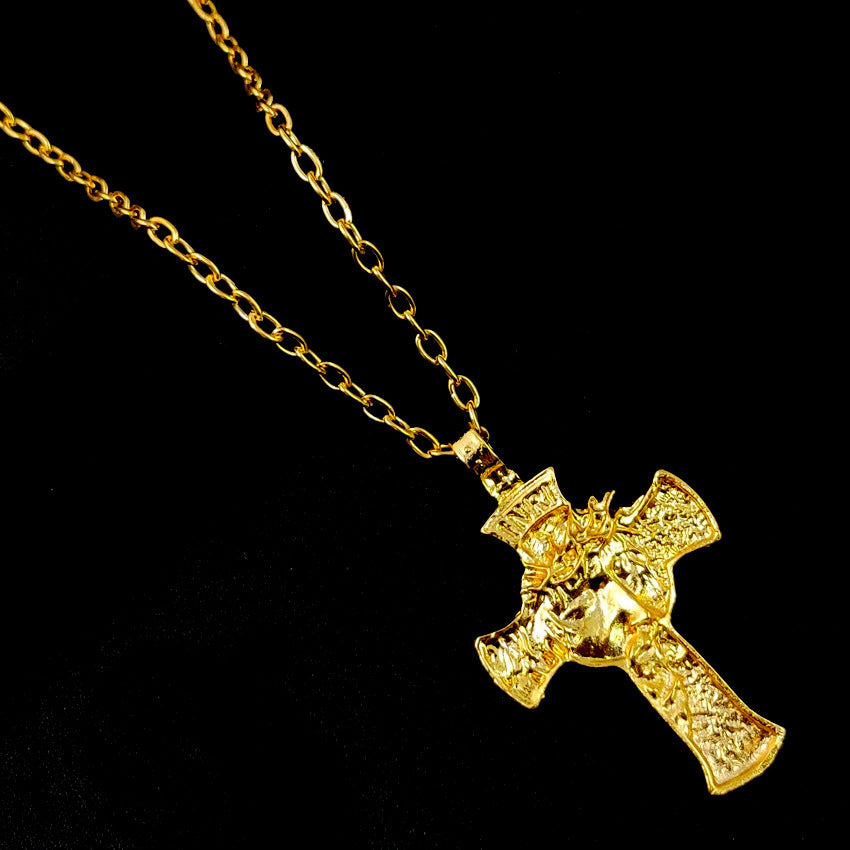 Thorn crown crucifix pendant on display against dark background