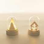 Luminous wooden house Christmas ornament glowing warmly on Christmas tree branches