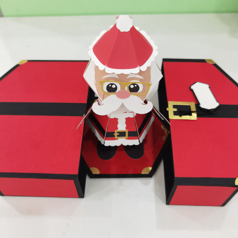 Close-up of festive paper gift box with Christmas bounce feature and holiday theme