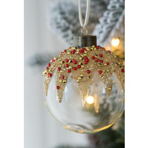 Twelve glass ball ornaments arranged together showing the complete set