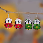 Festive cartoon penguin earrings with holiday colors for Christmas parties