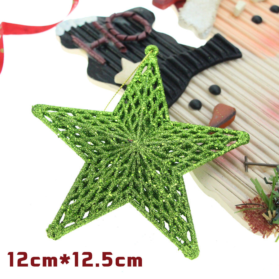 Three-dimensional plastic five-pointed star ornament in gold finish on white background