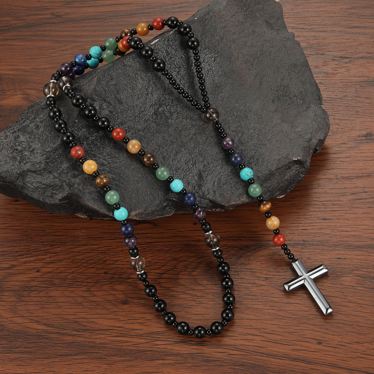 Colorful faith-inspired cross rosary necklace close-up view