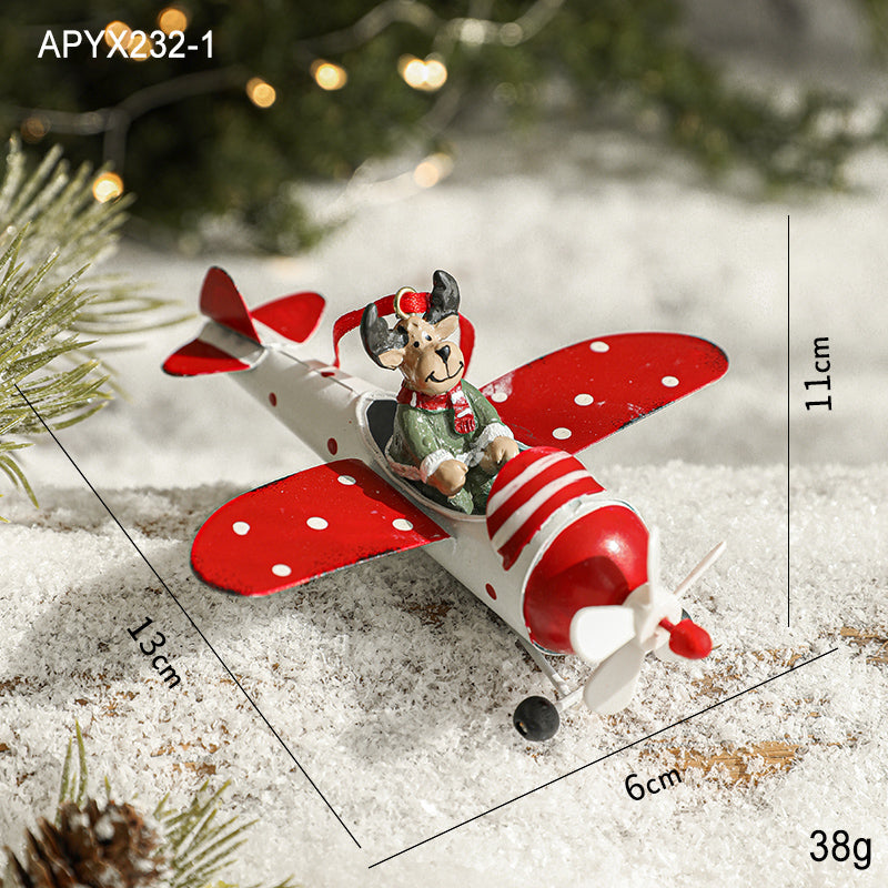Retro red and white painted Christmas tree ornament hanging on a tree