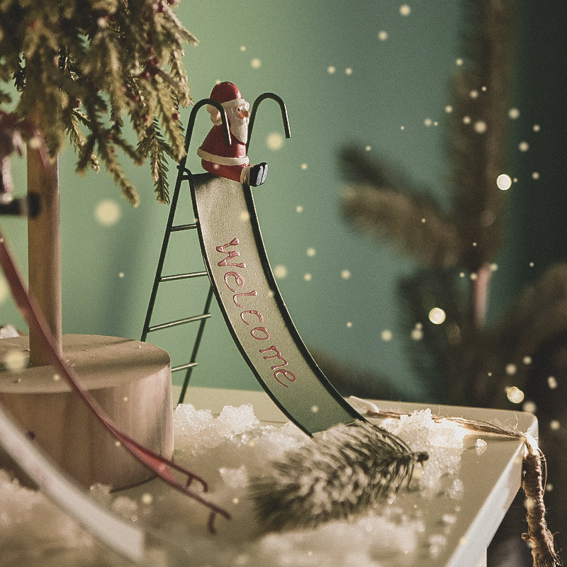 Close-up of red reindeer slide ornament in wrought iron for Christmas window display
