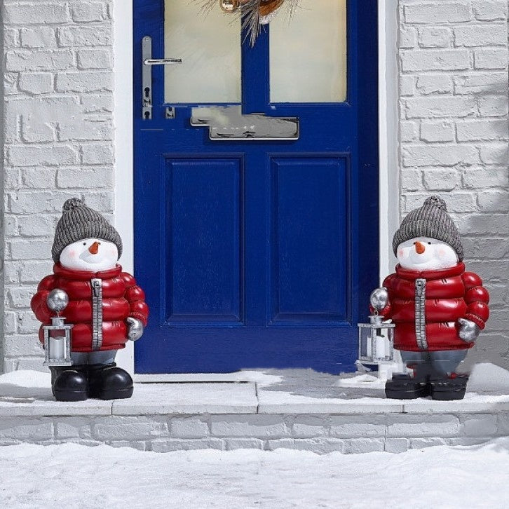 Handcrafted-looking snowman Christmas ornament with warm scarf for home holiday decor