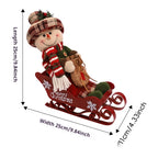 Sled doll ornament displayed on decorated Christmas tree