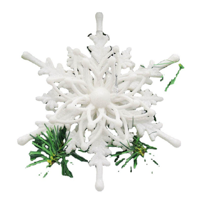 Christmas tree decorated with white snowflake ornaments in winter setting