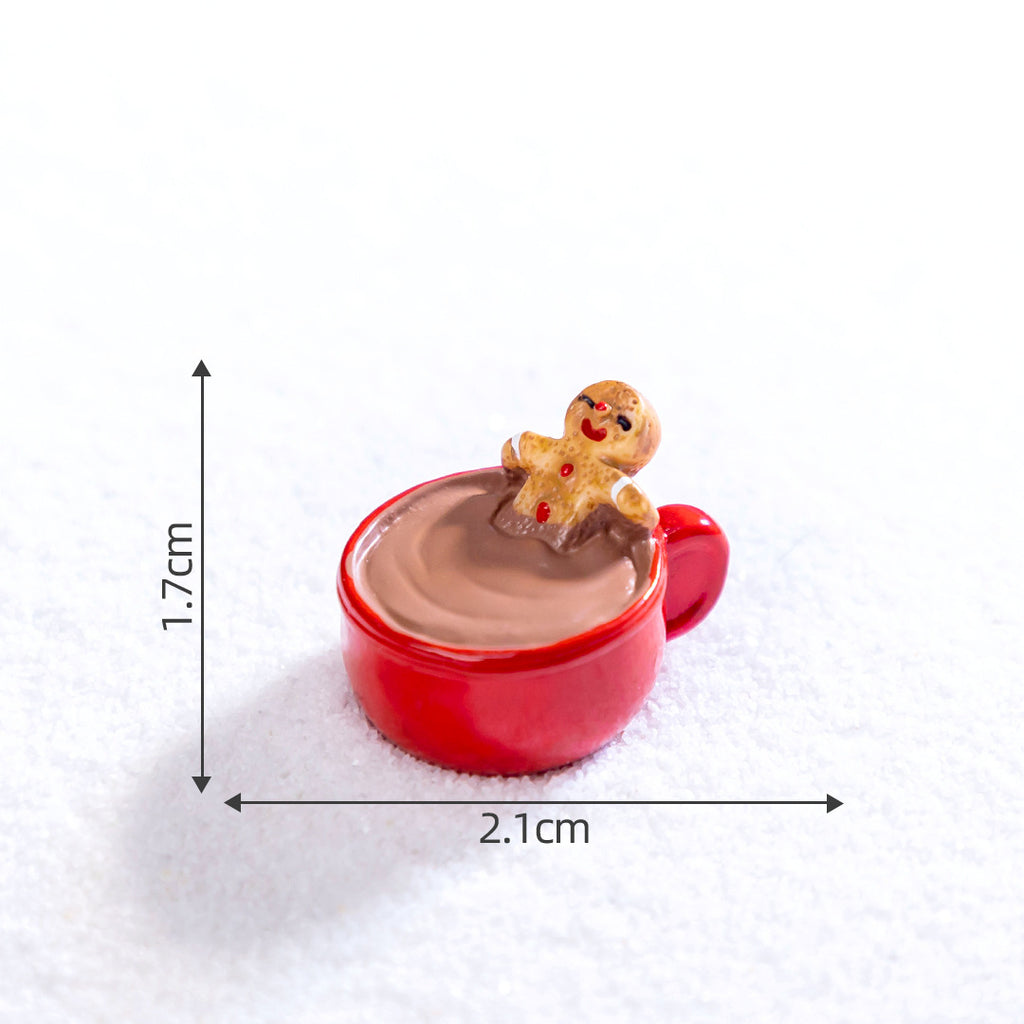 Hand holding a small gingerbread man ornament with holiday sparkle and warmth