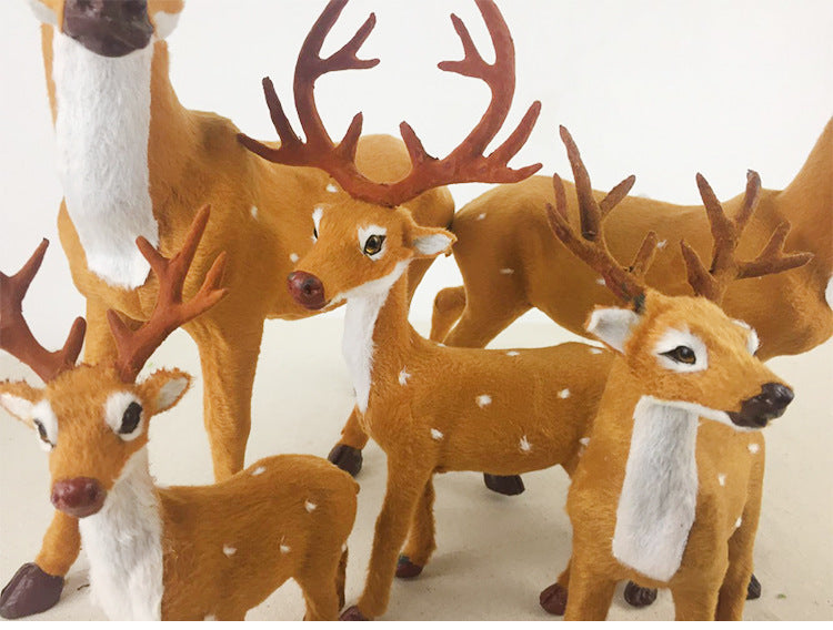 Miniature flocked deer ornaments showcasing woodland Christmas style