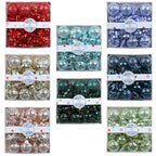 Green red and gold Christmas balls close up showing electroplated metallic shine