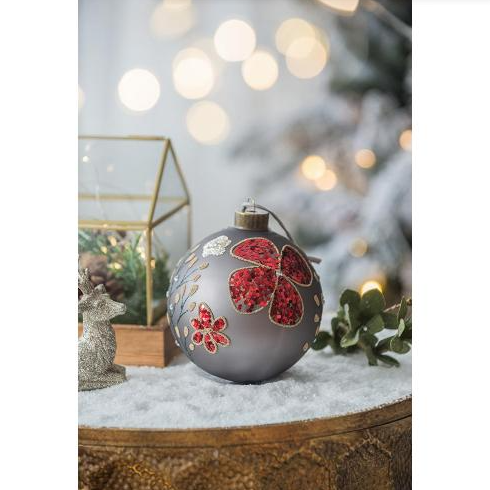 Four decorative glass Christmas balls in festive multicolor tones