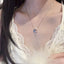 Delicate cross necklace with pearl and zircon pendant on elegant chain