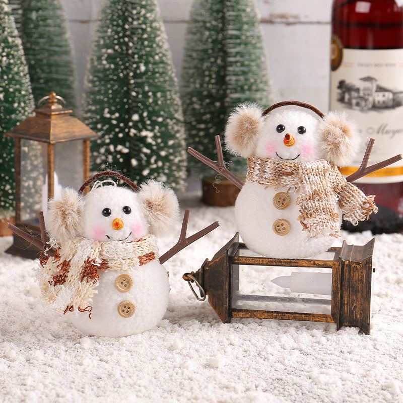 Luminous ice man Christmas ornament with festive scarf styling on display Main image