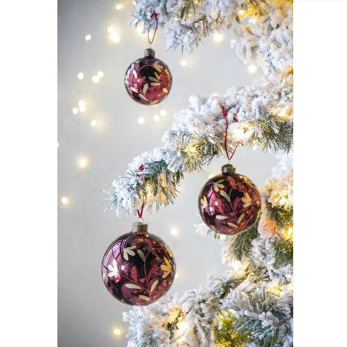 Group of six Christmas ball ornaments with painted red surface detail