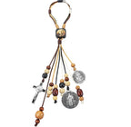 St Benedict Medal and Cross Pendant displayed on white surface