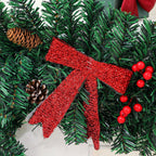 Rattan pine cone bow Christmas decoration arranged on white surface with warm holiday ambiance