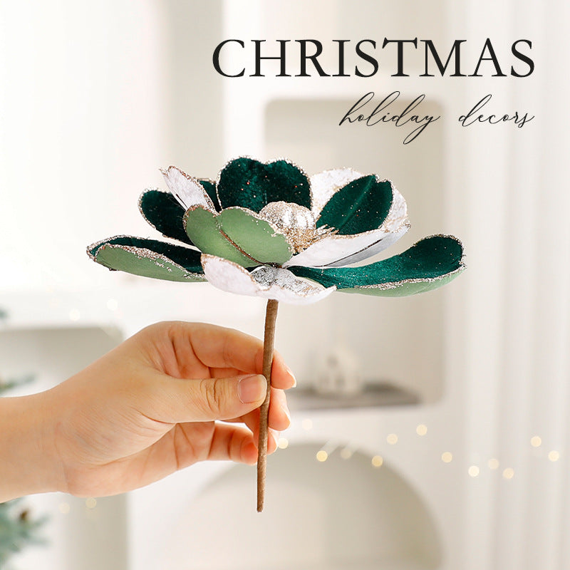 Christmas flower ornament hanging on fir tree branch