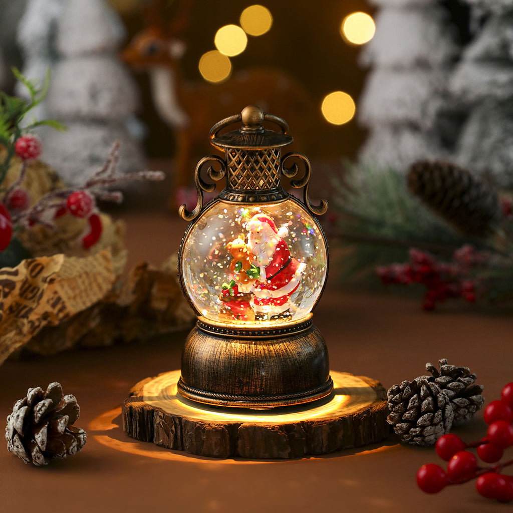 Musical Christmas ornament in snowman design hanging on tree branch