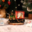 Gold train Christmas night lamp glowing warmly on a shelf