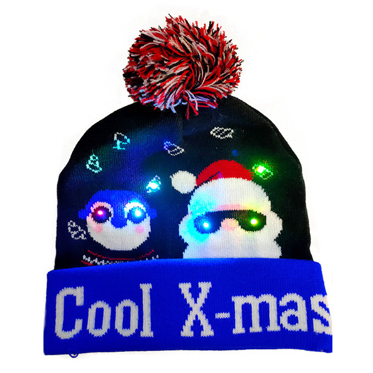 Cozy knitted Christmas cap in holiday colors with glowing lights