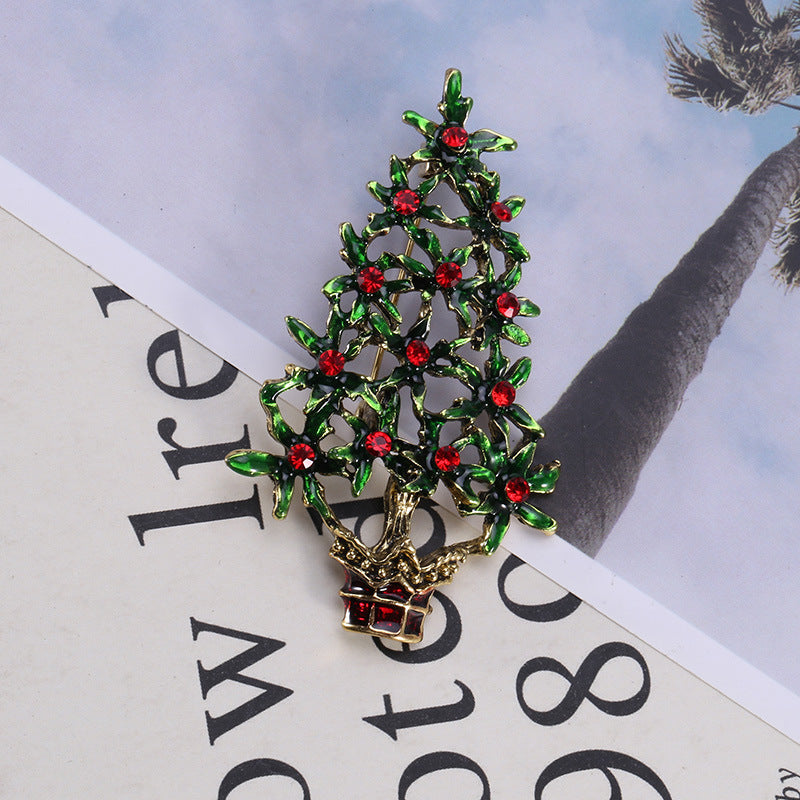 Elegant green brooch with Christmas tree design for holiday outfits