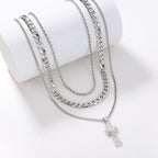 Close-up of layered cross pendant design on adjustable chain