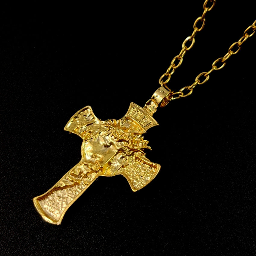 Detailed view of thorn crown surrounding crucifix pendant