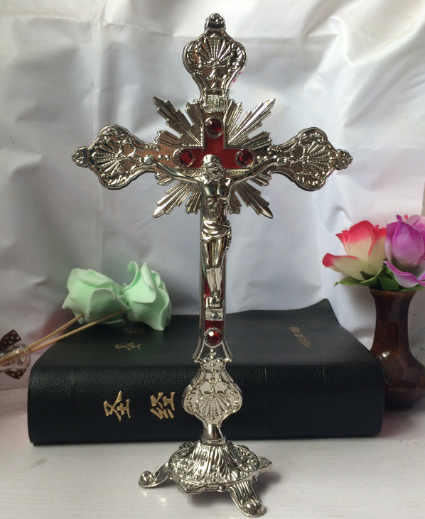 Baroque crucifixion wall ornament in gold finish with ornate detailing