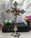 Baroque crucifixion wall ornament in gold finish with ornate detailing