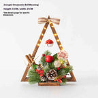 Pair of festive Christmas tree decorations with flowers and warm glowing lights