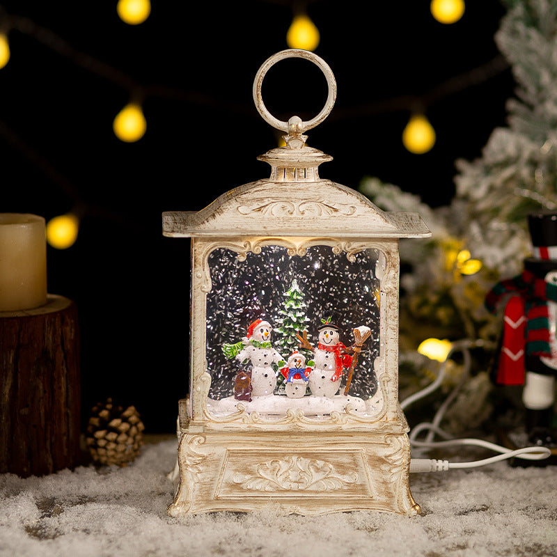 Christmas crystal ball music box with swirling snow and golden hoop decoration