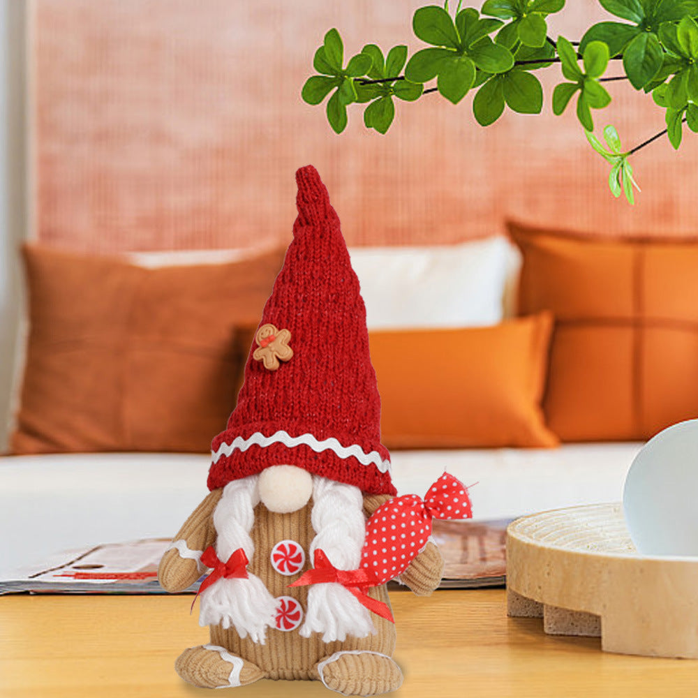 Knitted elderly Christmas ornament in men's dwarf variant on white background