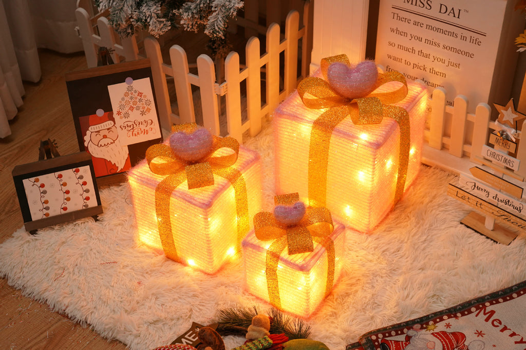 Silver star Christmas gift box lights adding sparkle to Christmas tree display