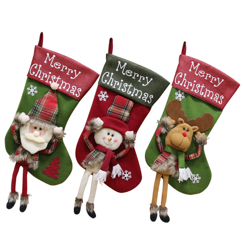 Three colorful Christmas stockings featuring Santa, Snowman, and Reindeer characters with 3D applique design for holiday fait