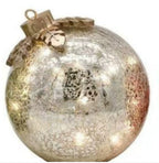 Holiday home decor arrangement with Christmas decorations