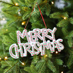 Festive Christmas ornament with holiday message close up