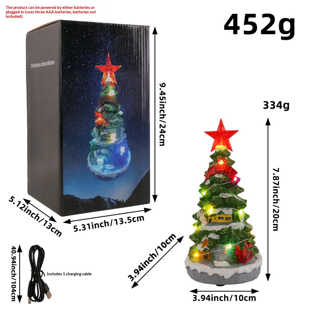 Christmas tree ornament with built-in music box and lights