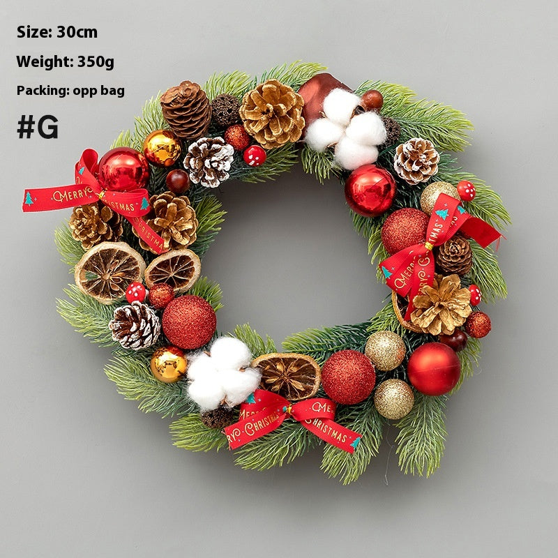 Upside down Christmas tree wreath with horn accents hanging on door Main image