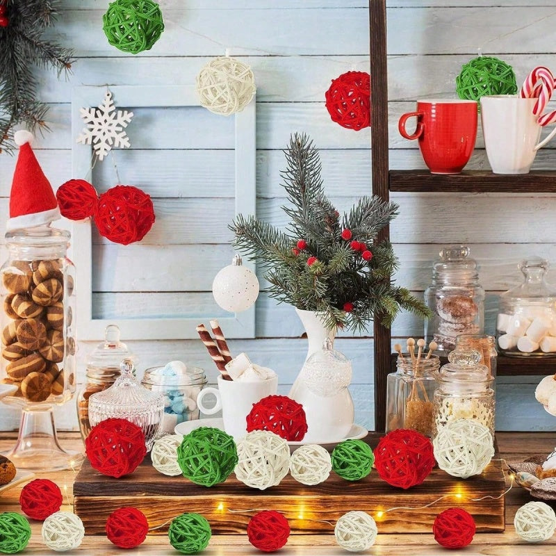 Handwoven Christmas rattan balls displayed in a glass vase with ribbon