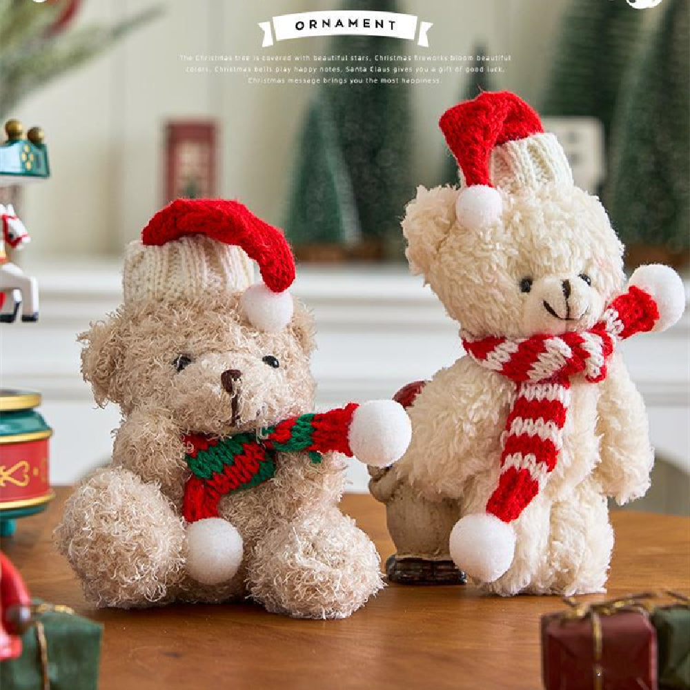 Christmas plush ornament displayed among green branches and holiday greenery