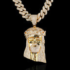 Close-up of gold-plated Jesus head pendant detail - copper jewelry