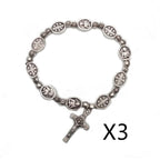 Rose bead rosary bracelet with Madonna and cross pendant on white background