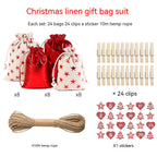 Gilded cloth Christmas gift bags laid out showing various red designs